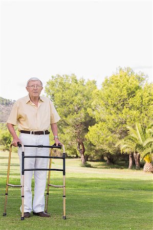 Portrait of elderly man using zimmer frame Stock Photo - Premium Royalty-Free, Code: 6109-06684842