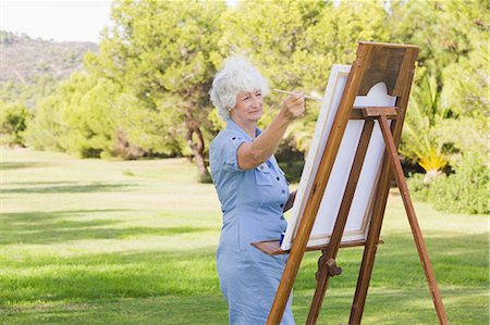 Woman painting in the park Stock Photo - Premium Royalty-Free, Code: 6109-06684848