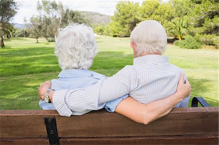 people sitting on bench - Loving elderly couple on a park bench Stock Photo - Premium Royalty-Free, Code: 6109-06684818