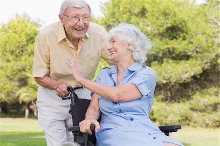 disable - Old man laughing with his partner in a wheelchair Stock Photo - Premium Royalty-Free, Code: 6109-06684833