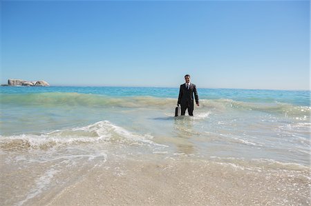 simsearch:6109-06684997,k - Businessman standing in the sea Stock Photo - Premium Royalty-Free, Code: 6109-06781642