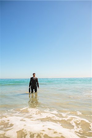 simsearch:6109-06684997,k - Businessman standing in the sea Stock Photo - Premium Royalty-Free, Code: 6109-06781645