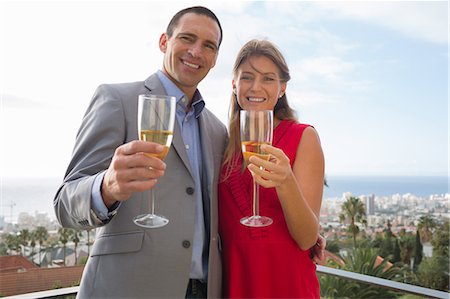 simsearch:400-05686653,k - Couple toasting with champagne Stock Photo - Premium Royalty-Free, Code: 6109-06781611