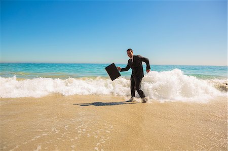 simsearch:6109-06684997,k - Businessman gesturing on the beach Stock Photo - Premium Royalty-Free, Code: 6109-06781638