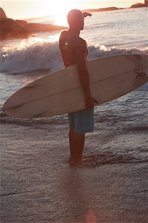 surfers in water - Silhouette of an attractive man looking at the sea Stock Photo - Premium Royalty-Free, Code: 6109-06781819