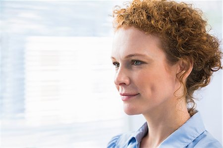 red haired businesswomen - Thoughtful red hair businesswoman posing at meeting room Stock Photo - Premium Royalty-Free, Code: 6109-07496996