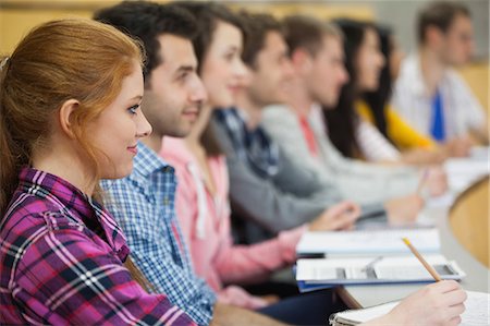 Row of students listening in a lecture hall in college Stock Photo - Premium Royalty-Free, Code: 6109-07497653