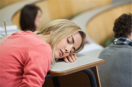 slumber - Blonde student sleeping in a lecture hall in college Stock Photo - Premium Royalty-Free, Code: 6109-07497650