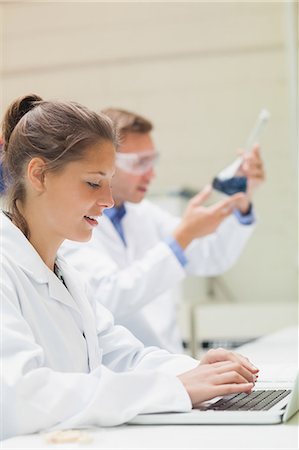 students in laboratory pictures - Happy student working at laptop in lab at college Stock Photo - Premium Royalty-Free, Code: 6109-07497819