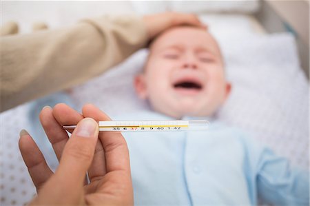 simsearch:632-03424324,k - Mother examining ailing babys temperature Stock Photo - Premium Royalty-Free, Code: 6109-07600990