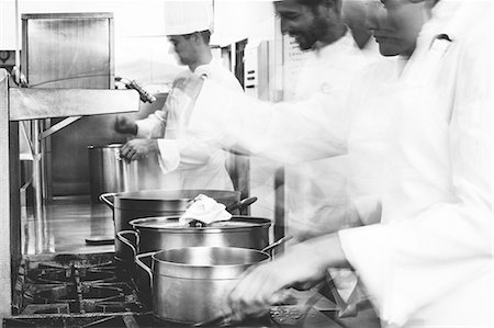 restaurant indoor - Busy team of chefs at work Stock Photo - Premium Royalty-Free, Code: 6109-07601070