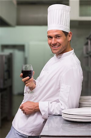 simsearch:6109-07601170,k - Chef relaxing with glass of red wine after work Stock Photo - Premium Royalty-Free, Code: 6109-07601167