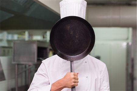 simsearch:6109-07601170,k - Chef covering face with pan Stock Photo - Premium Royalty-Free, Code: 6109-07601164