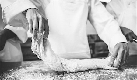 Chefs preparing dough at counter Stock Photo - Premium Royalty-Free, Code: 6109-07601106