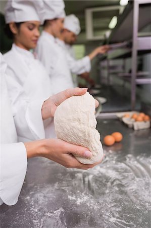 simsearch:6109-07601098,k - Chefs preparing dough at counter Stock Photo - Premium Royalty-Free, Code: 6109-07601110
