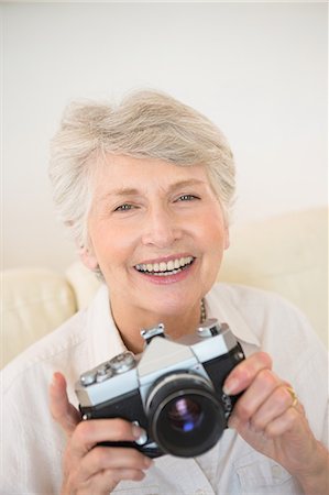 elderly portrait - Senior woman taking a photograph Stock Photo - Premium Royalty-Free, Code: 6109-07601471