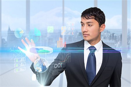 digital - Asian businessman touching interface Stock Photo - Premium Royalty-Free, Code: 6109-07601601