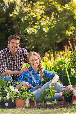 Happy young couple gardening together Stock Photo - Premium Royalty-Free, Code: 6109-08203096