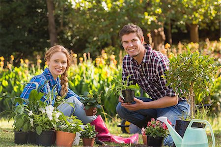 Happy young couple gardening together Stock Photo - Premium Royalty-Free, Code: 6109-08203099