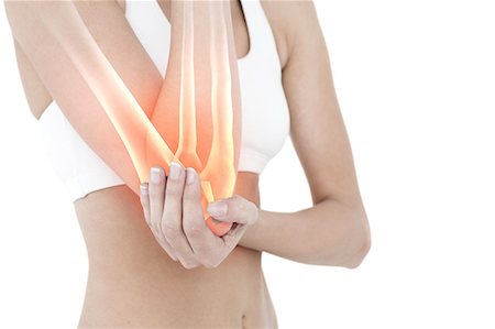 elbow - Highlighted elbow pain of woman Stock Photo - Premium Royalty-Free, Code: 6109-08203011