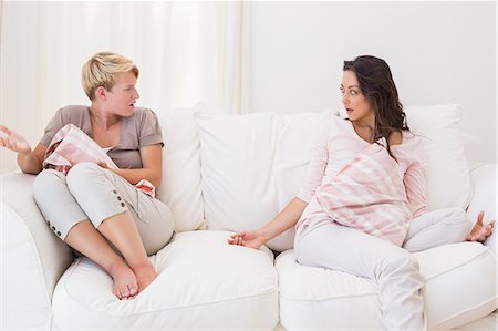 simsearch:6109-07601529,k - Homosexual couple sitting on couch and disputing Stock Photo - Premium Royalty-Free, Code: 6109-08203469