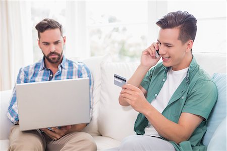 Homosexual couple men working on laptop Stock Photo - Premium Royalty-Free, Code: 6109-08203568