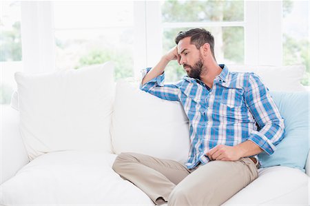 Unhappy man suffering from migraine Stock Photo - Premium Royalty-Free, Code: 6109-08203575