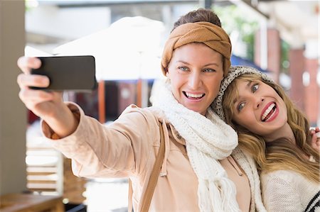 shopaholic (female) - Smiling women making a selfie Stock Photo - Premium Royalty-Free, Code: 6109-08204142