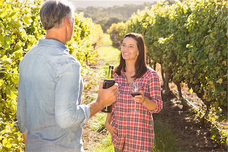 simsearch:6109-08204218,k - Smiling couple talking about wine Stock Photo - Premium Royalty-Free, Code: 6109-08204351