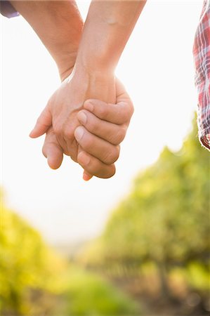 simsearch:6109-08204218,k - Close up view of couple holding hands Stock Photo - Premium Royalty-Free, Code: 6109-08204355
