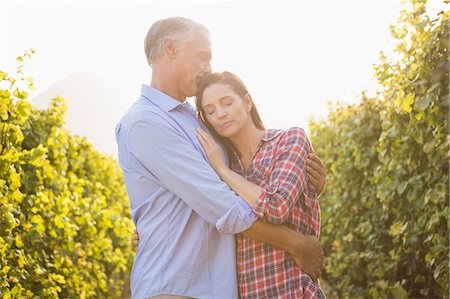 simsearch:6109-08204218,k - Happy man embracing and kissing his woman Stock Photo - Premium Royalty-Free, Code: 6109-08204358