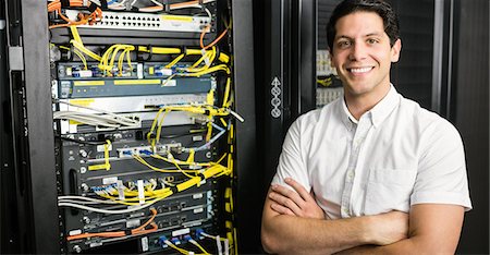 system - Confident technician smiling at camera Stock Photo - Premium Royalty-Free, Code: 6109-08389841