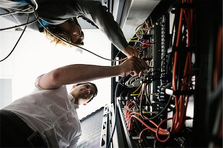 powerful (engine) - Team of technicians working together on servers Stock Photo - Premium Royalty-Free, Code: 6109-08389884
