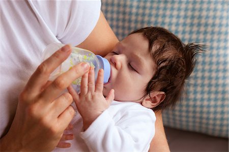 simsearch:6109-08390041,k - Newborn being fed by the mother Stock Photo - Premium Royalty-Free, Code: 6109-08390043