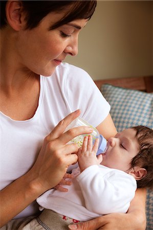 simsearch:6109-08390041,k - Newborn being fed by the mother Stock Photo - Premium Royalty-Free, Code: 6109-08390044
