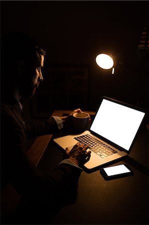 Handsome hipster working into the night Stock Photo - Premium Royalty-Free, Code: 6109-08390052