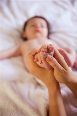 simsearch:6109-07497438,k - Mother holding her newborns foot Stock Photo - Premium Royalty-Free, Code: 6109-08390027