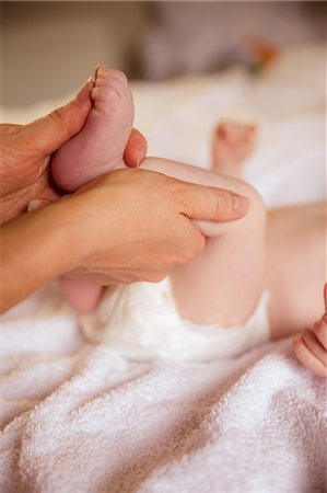 simsearch:6109-07497438,k - Mother holding her newborns foot Stock Photo - Premium Royalty-Free, Code: 6109-08390029