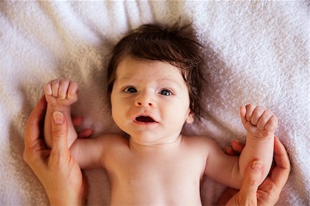 simsearch:6109-08390041,k - Cute newborn laying on changing table Stock Photo - Premium Royalty-Free, Code: 6109-08390030