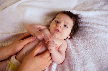 simsearch:6109-08390041,k - Mother touching her newborns body Stock Photo - Premium Royalty-Free, Code: 6109-08390031