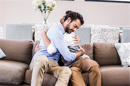 people happy embracing - Happy gay couple hugging each other Stock Photo - Premium Royalty-Free, Code: 6109-08390144