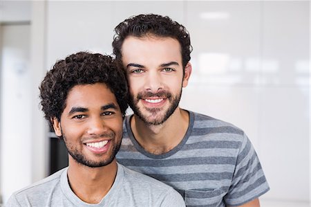 simsearch:6109-08390293,k - Smiling gay couple looking at camera Stock Photo - Premium Royalty-Free, Code: 6109-08390248
