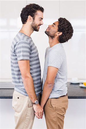 simsearch:6109-08390293,k - Happy gay couple holding their hands Stock Photo - Premium Royalty-Free, Code: 6109-08390250