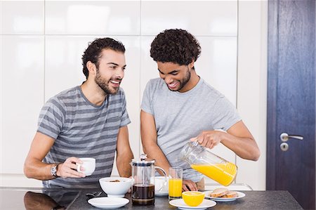 simsearch:6109-08390293,k - Happy gay couple having breakfast and talking Stock Photo - Premium Royalty-Free, Code: 6109-08390257