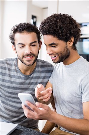 simsearch:6109-08390293,k - Happy gay couple using smartphone Stock Photo - Premium Royalty-Free, Code: 6109-08390263