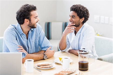 simsearch:6109-08390293,k - Happy gay couple having breakfast and talking Stock Photo - Premium Royalty-Free, Code: 6109-08390267