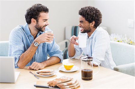 simsearch:6109-08390293,k - Happy gay couple having breakfast and talking Stock Photo - Premium Royalty-Free, Code: 6109-08390268