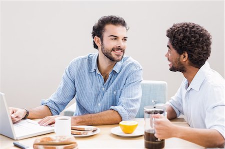 simsearch:6109-08390293,k - Happy gay couple having breakfast and using laptop Stock Photo - Premium Royalty-Free, Code: 6109-08390273