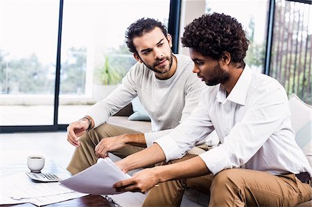 recession - Gay couple paying bills Stock Photo - Premium Royalty-Free, Code: 6109-08390208