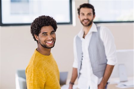 studio creative group - Smiling man with partner in background Stock Photo - Premium Royalty-Free, Code: 6109-08390358